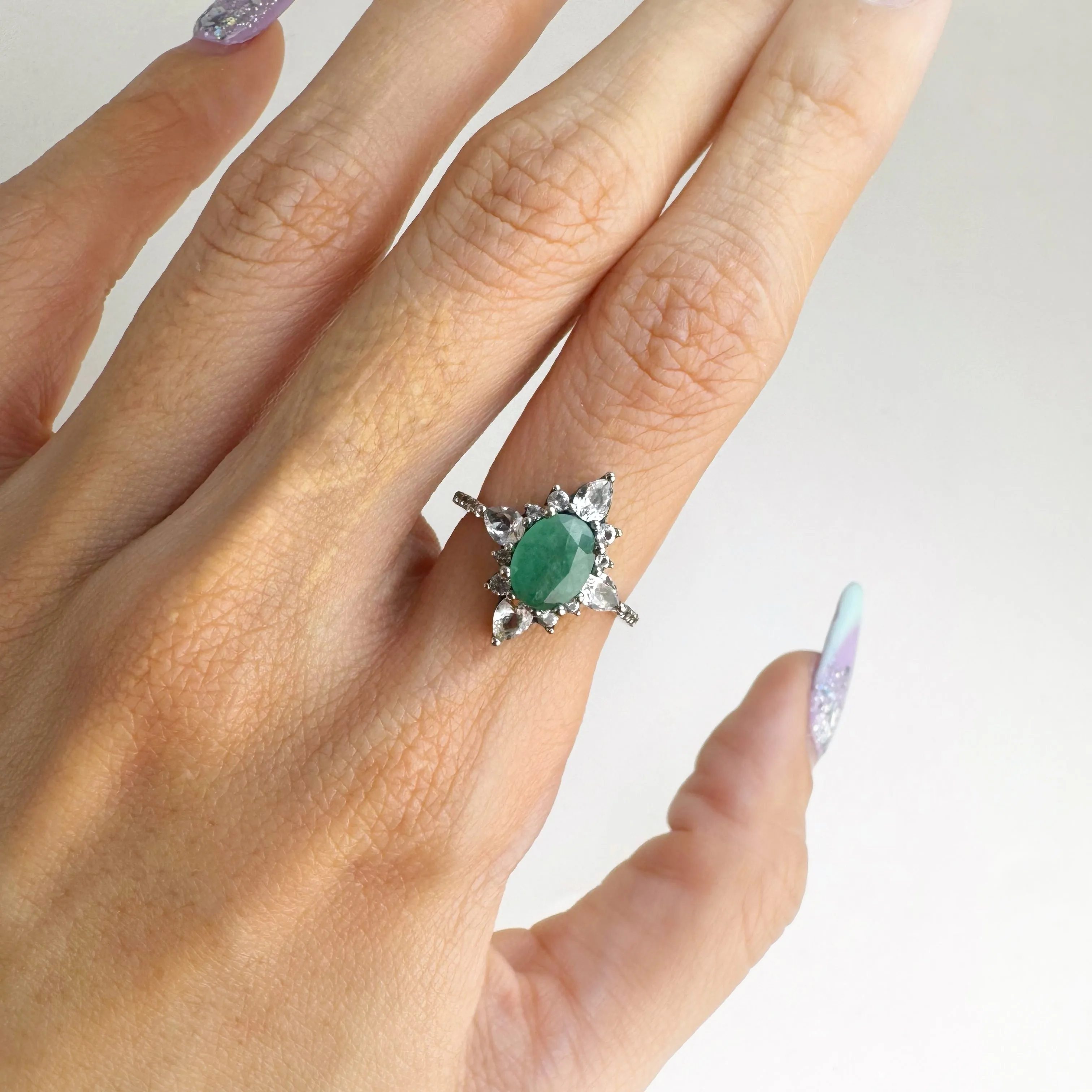 6 x 8 mm. Oval Cut Green Zambian Emerald with Topaz Accents Ring