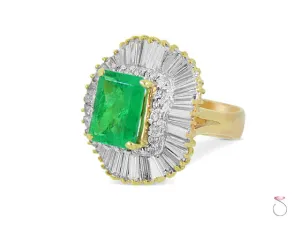 6.00 ct Emerald Ballerina Ring with 3.00 ct Diamond Halo in 18K