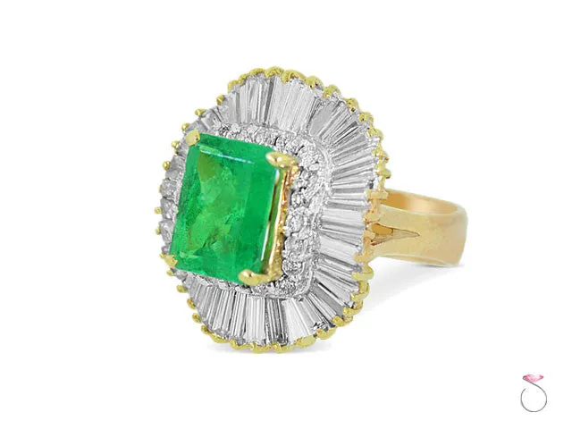 6.00 ct Emerald Ballerina Ring with 3.00 ct Diamond Halo in 18K