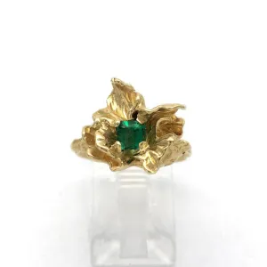 Blossom set with an emerald