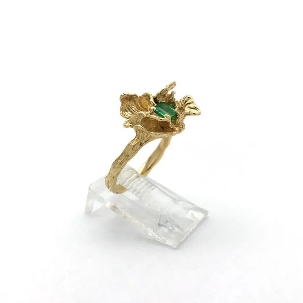 Blossom set with an emerald