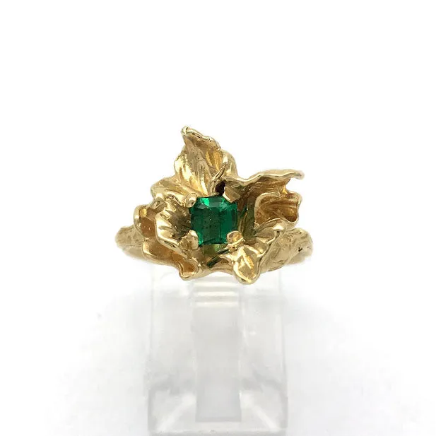 Blossom set with an emerald