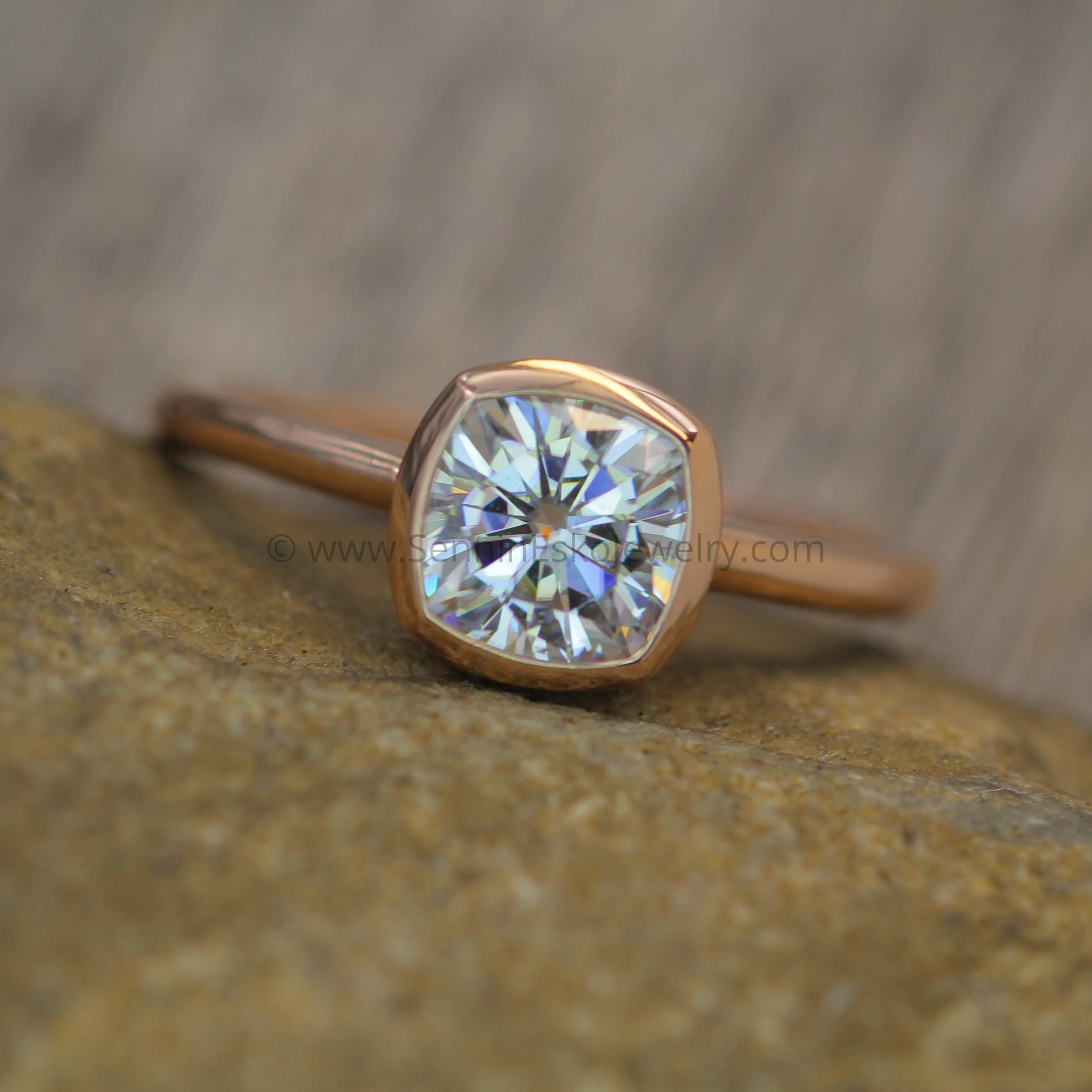 Colorless Moissanite 6x6mm Cushion Cut Bezel Solitaire Ring With A Medium/Lightweight Band