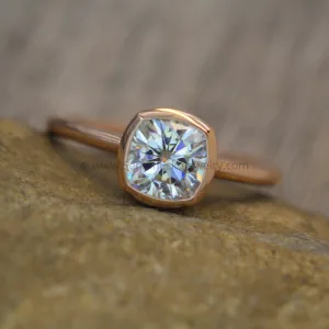 Colorless Moissanite 6x6mm Cushion Cut Bezel Solitaire Ring With A Medium/Lightweight Band