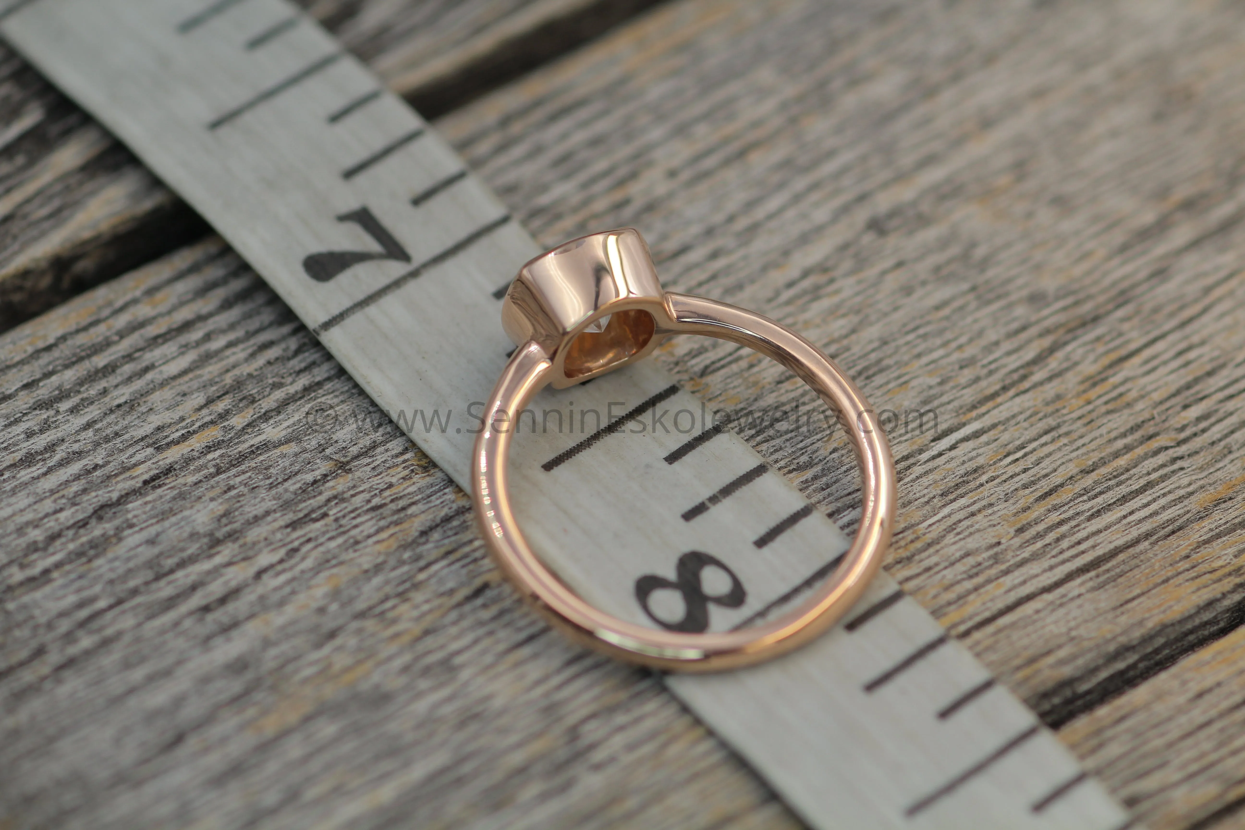 Colorless Moissanite 6x6mm Cushion Cut Bezel Solitaire Ring With A Medium/Lightweight Band