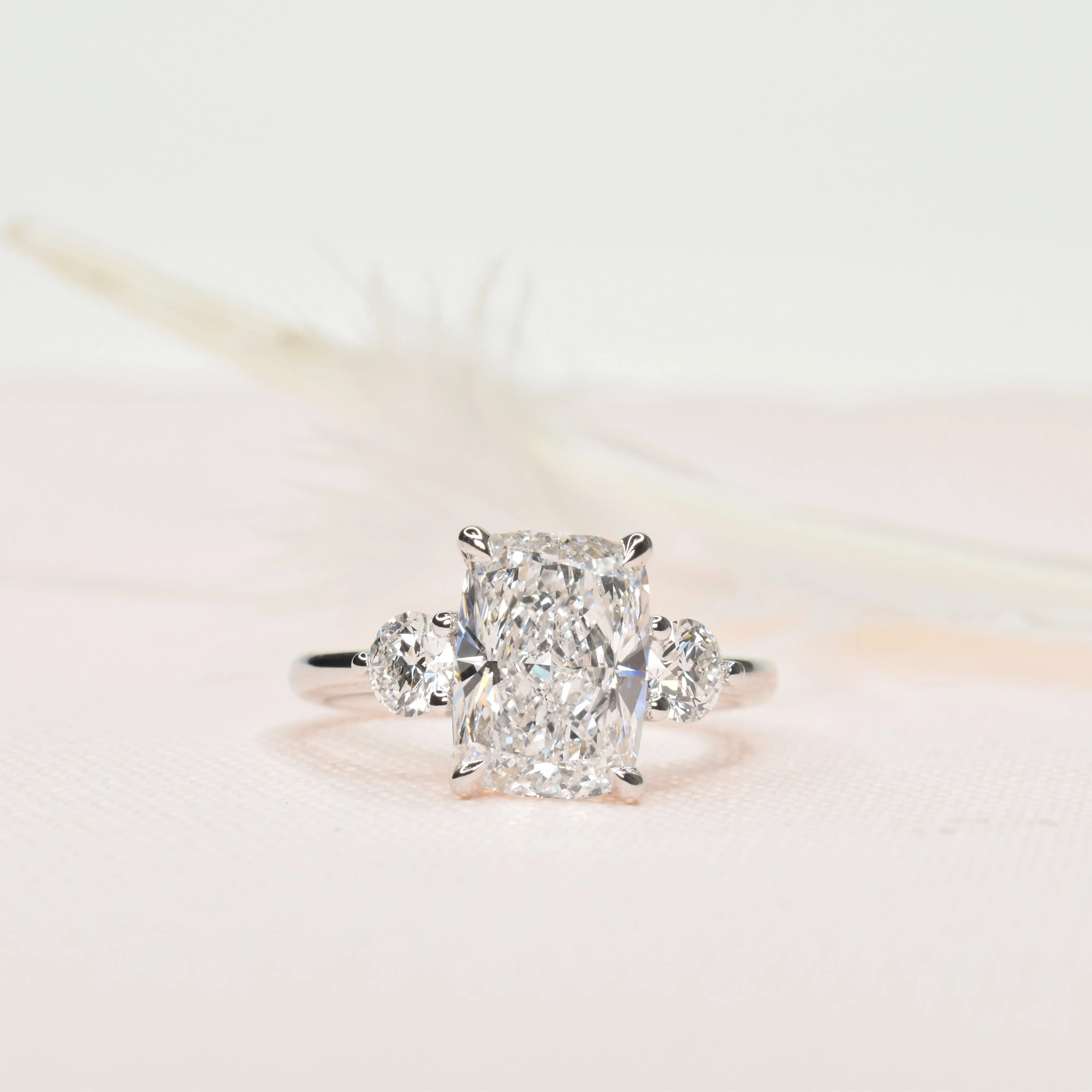 Long Cushion Cut with Round Side stones