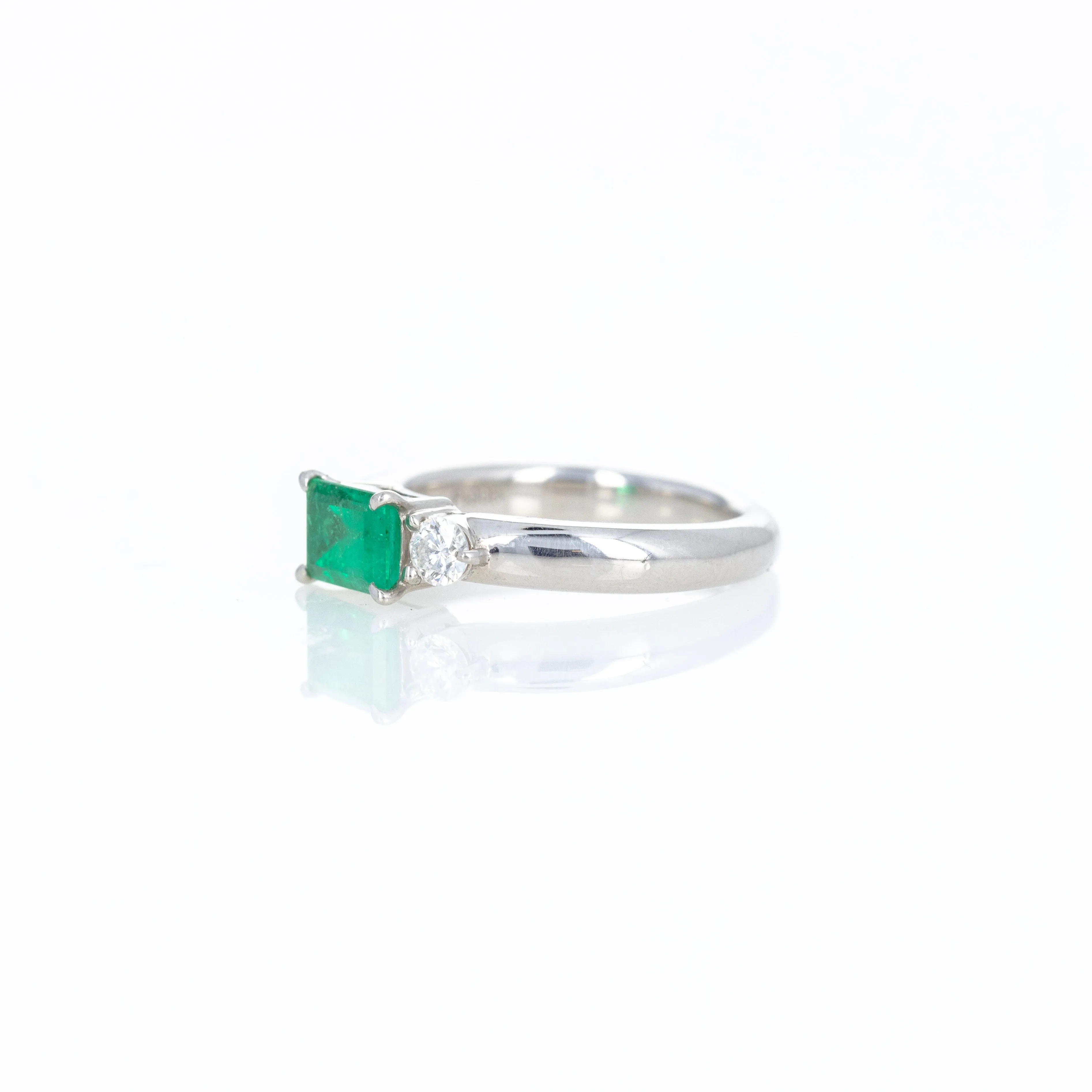 Platinum 0.71 Carat Emerald Diamond Three Stone Ring