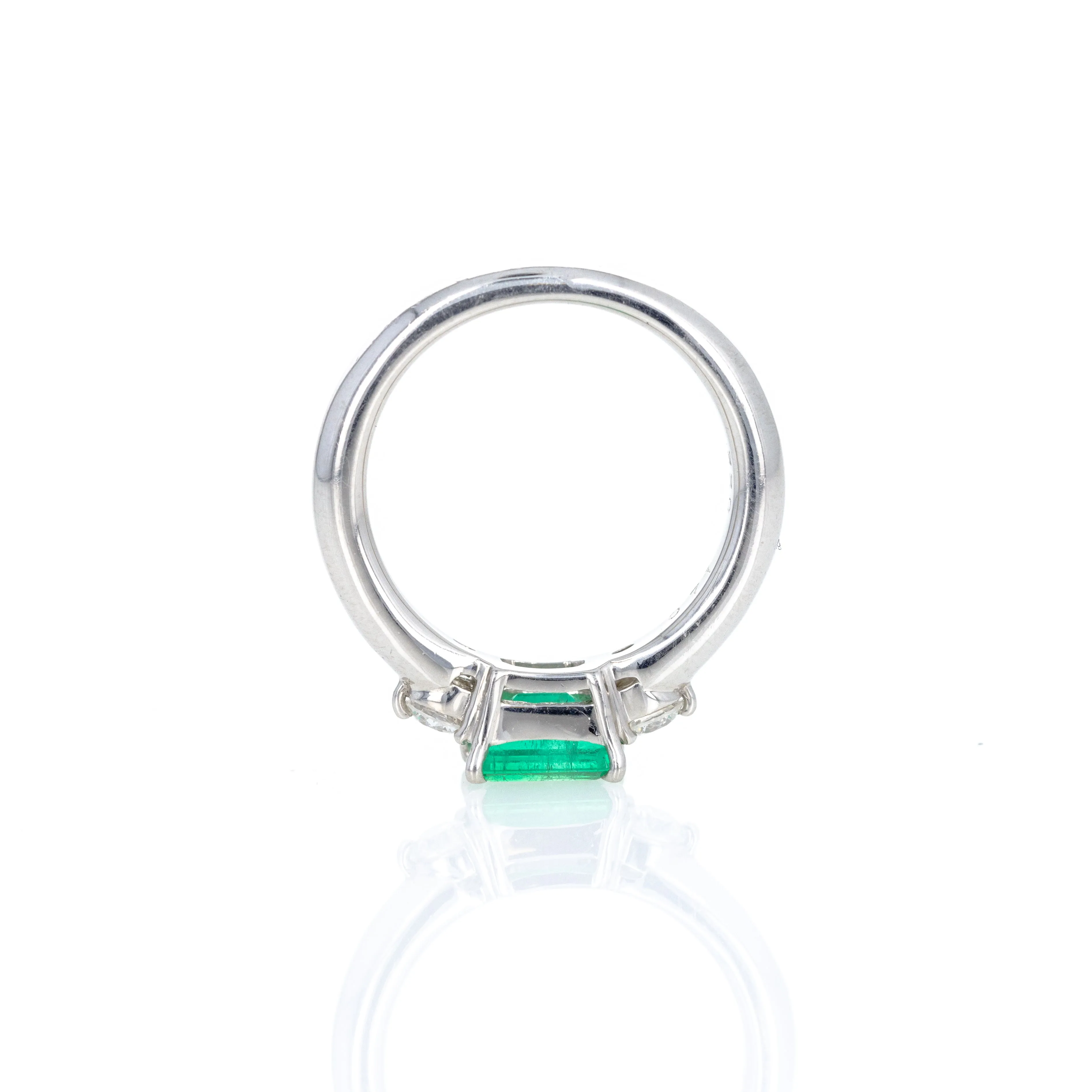 Platinum 0.71 Carat Emerald Diamond Three Stone Ring