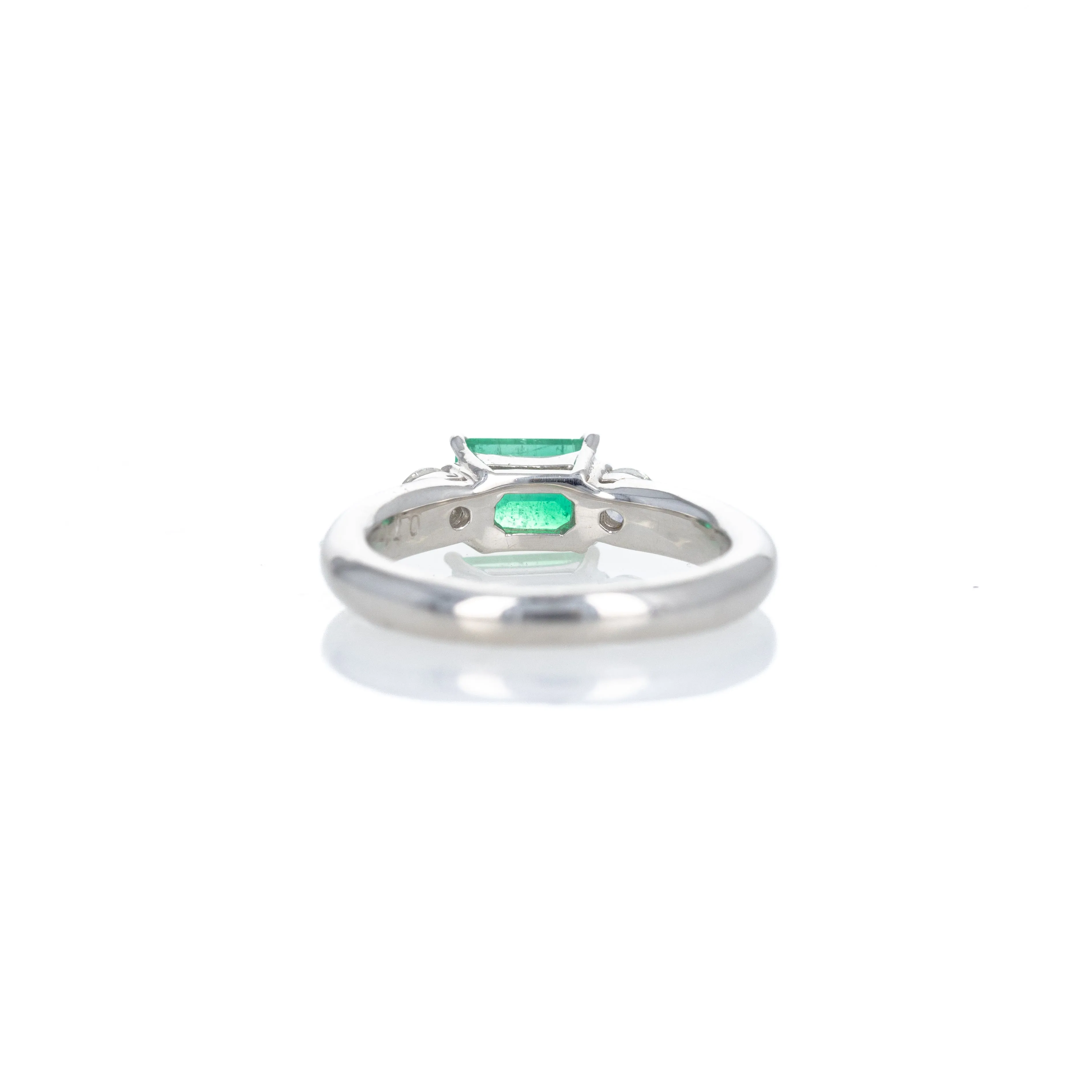 Platinum 0.71 Carat Emerald Diamond Three Stone Ring