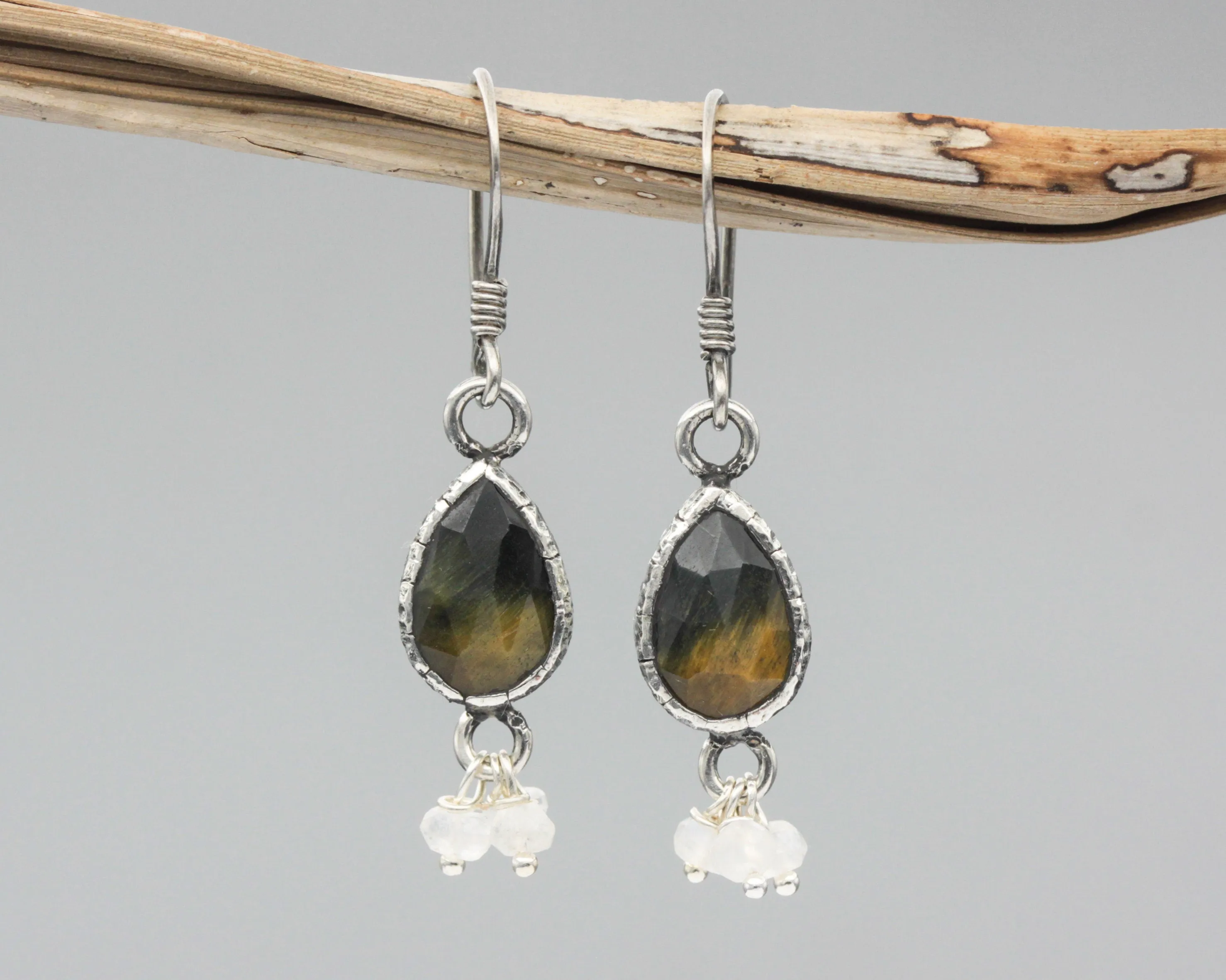 Teardrop Tiger's Eye earrings in silver bezel setting with moonstone beads on oxidized sterling silver hooks