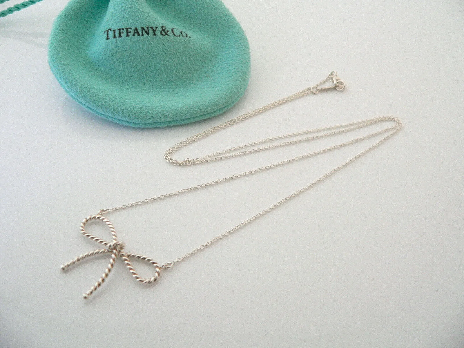 Tiffany & Co Silver Ribbon Necklace Twisted Bow Pendant Charm Chain Gift Pouch