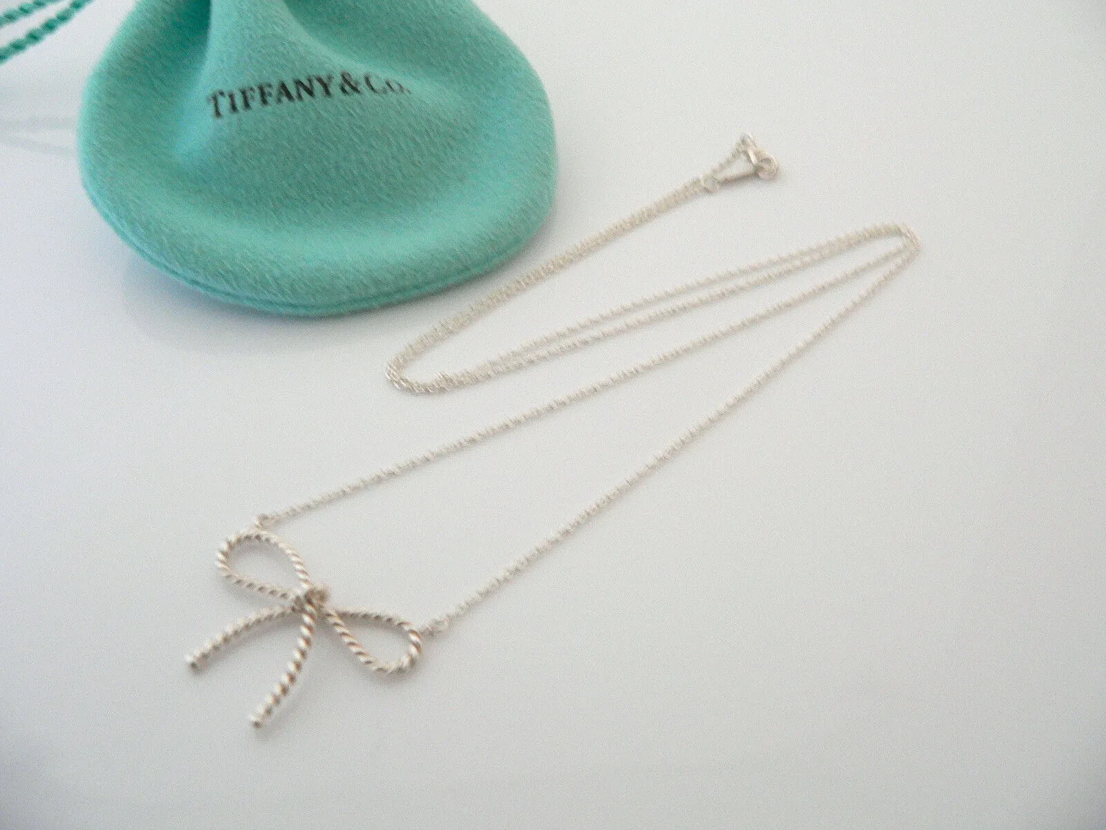 Tiffany & Co Silver Ribbon Necklace Twisted Bow Pendant Charm Chain Gift Pouch