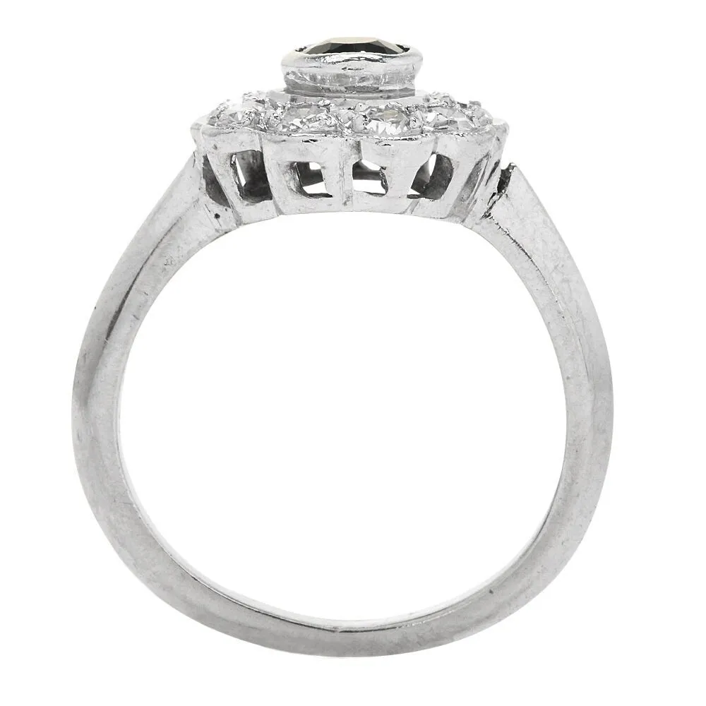 Vintage Emerald and Diamond Floral Halo Ring in Platinum