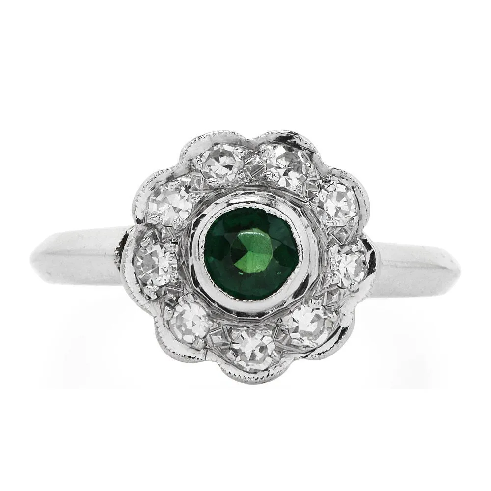 Vintage Emerald and Diamond Floral Halo Ring in Platinum